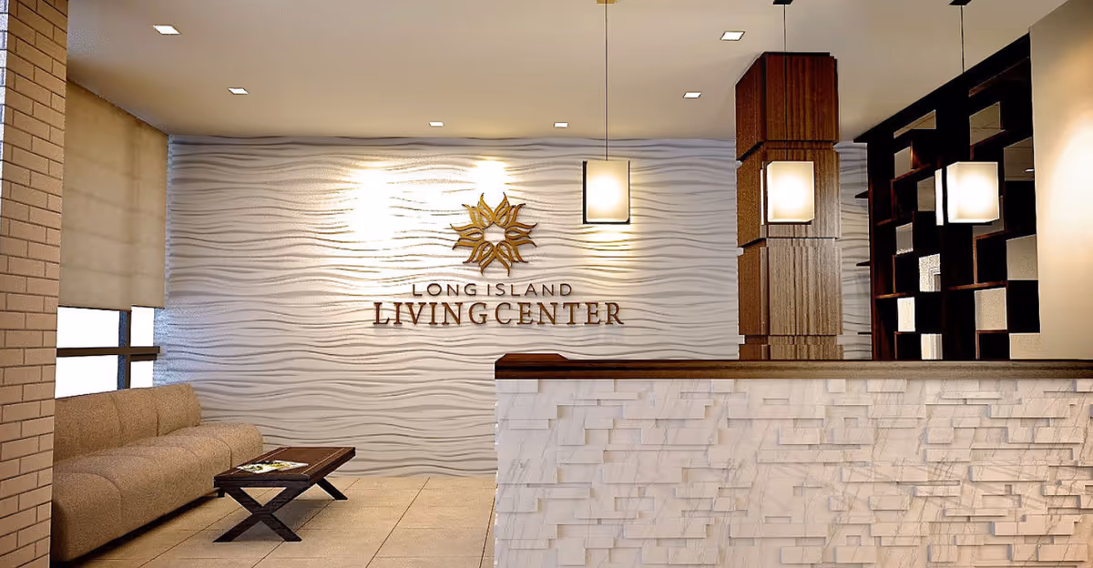 Reception lobby of Long Island Living Center with a textured wave wall, front desk, seating area and pendant lights.