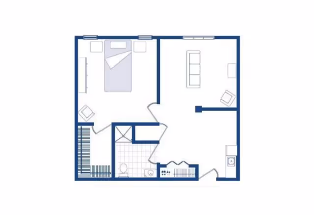 Floor plan of a senior living unit showing a bedroom with a bed, two nightstands, and a chair; a bathroom with a toilet and sink; a living room with a sofa and chair; and a kitchen area with a sink and stove.
