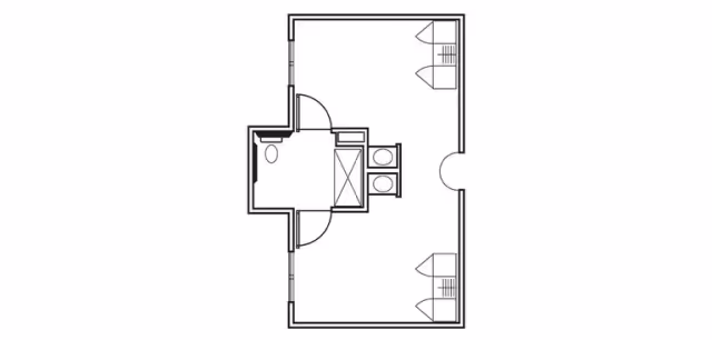 Architectural floor plan of a memory care unit at Monterey Court Memory Care, showing a layout with a bathroom including a toilet and shower, a double sink area, and two separate rooms with closets.