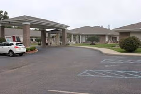 Front exterior of Holzer Assisted Living Gallipolis with a covered drop-off and parking area.