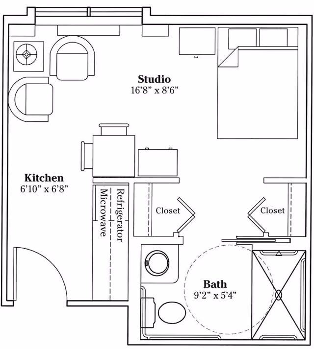 Floor plan of a studio apartment at The Wyngate Senior Living Community-Lima, showing a kitchen area, a studio living and sleeping space, two closets, and a bathroom with a shower, toilet, and sink.