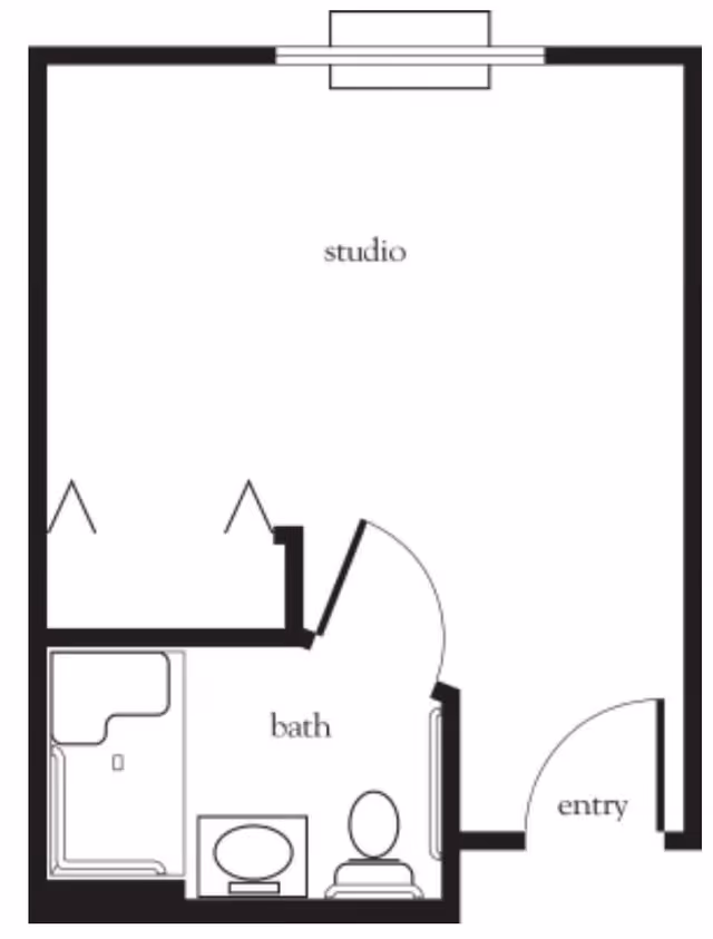 Floor plan of a studio apartment showing an entry area, a combined studio living space, and a bathroom with a shower, toilet, and sink.