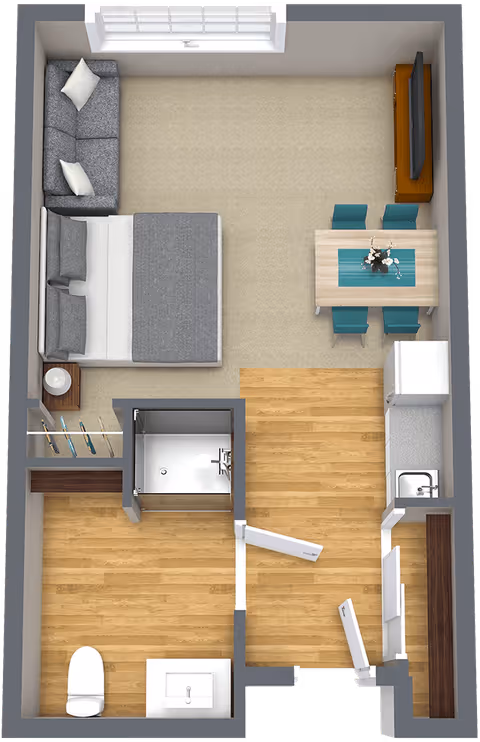Top-down view of a small apartment layout showing a combined bedroom and living area with a bed, sofa, dining table with four chairs, and a TV on a stand. Adjacent to this area is a kitchen with a refrigerator, sink, and counter space. There is a separate bathroom with a toilet, sink, and shower. The flooring is a mix of carpet and wood.