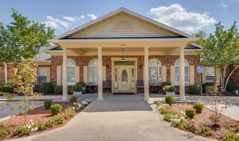 Front view of Westbrook Terrace Senior Living building with brick exterior and covered entrance.