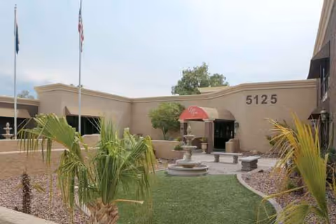 Exterior view of Bella Vita Health & Rehabilitation Center with courtyard, fountain, and landscaping.