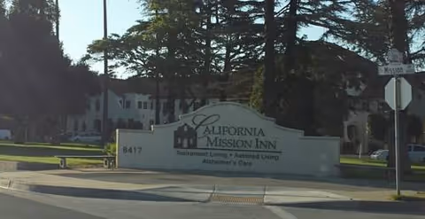 Exterior view of the California Mission Inn entrance with its front sign.