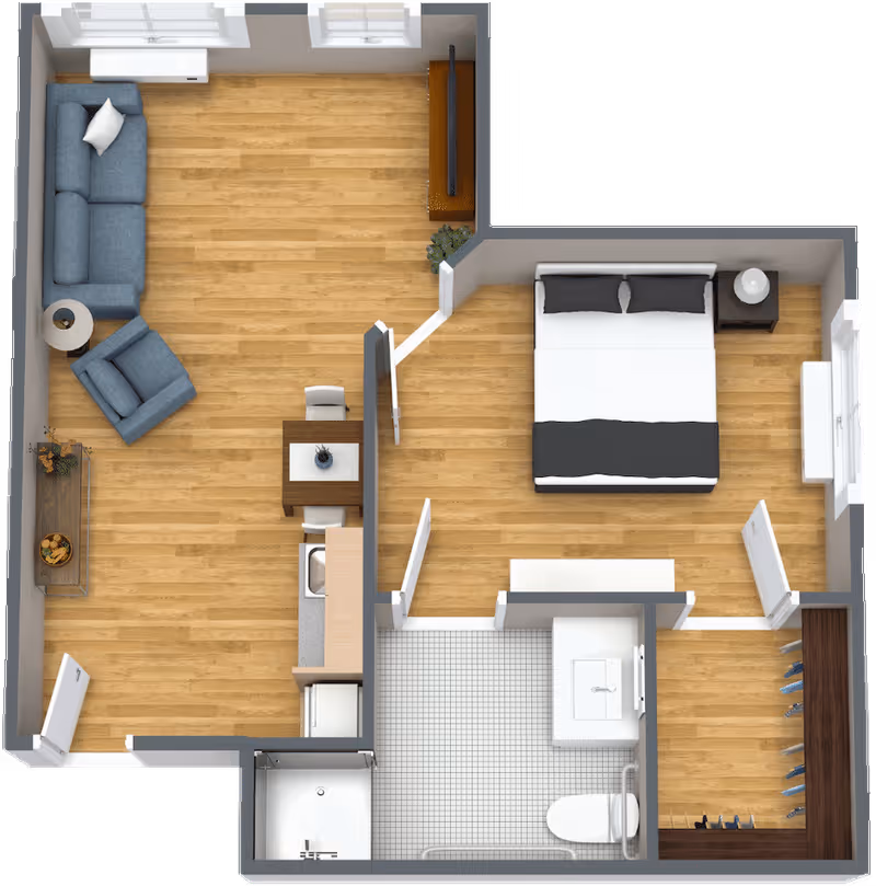 Top-down view of a one-bedroom assisted living apartment floor plan featuring a living room with a sofa, armchair, side table, and TV, a small dining table with two chairs, a kitchenette, a bedroom with a double bed and nightstand, a bathroom with a shower, toilet, and sink, and a walk-in closet.