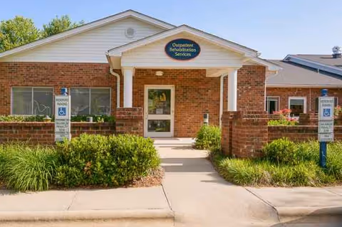 Exterior view of Life Care Center of Hendersonville with brick front and landscaping.