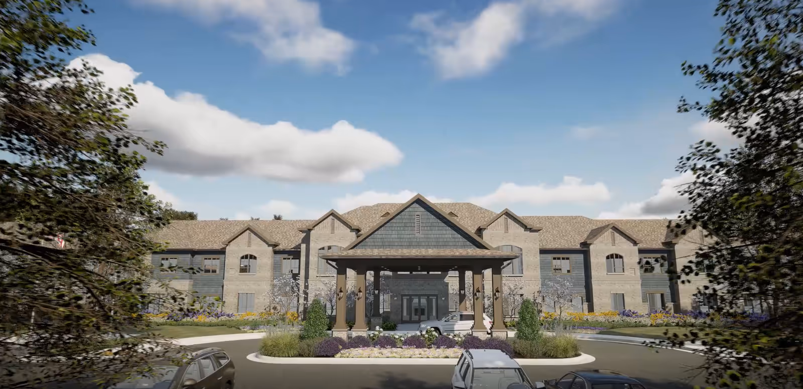 Front exterior view of Harmony at Douglasville, a brick senior living facility with landscaped entrance.