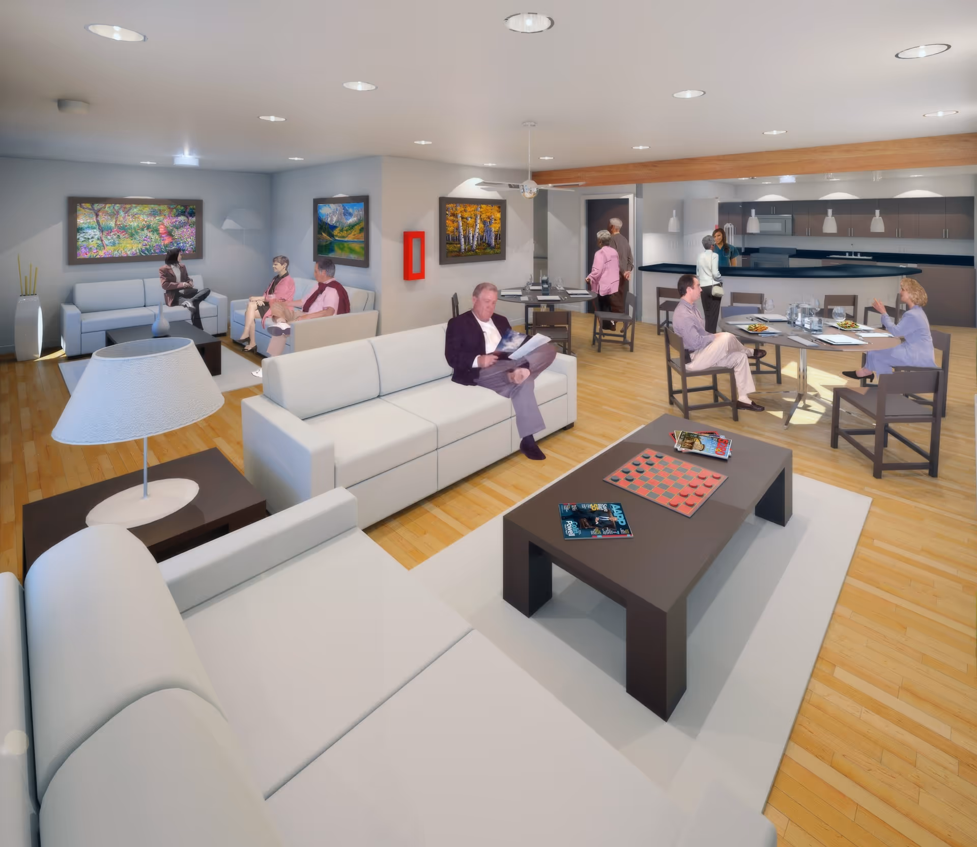A spacious senior living common area with several people sitting and conversing. The room features white sofas, a coffee table with magazines and a checkerboard, wooden flooring, and colorful landscape paintings on the walls. In the background, there is a kitchen area with a counter and pendant lights, and a dining table where some people are seated and eating.