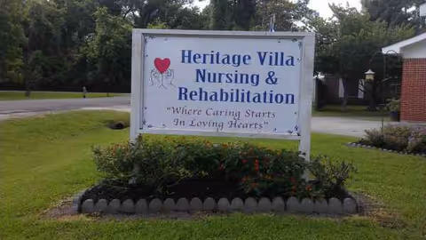 Heritage Villa Nursing & Rehabilitation sign on a manicured front lawn.