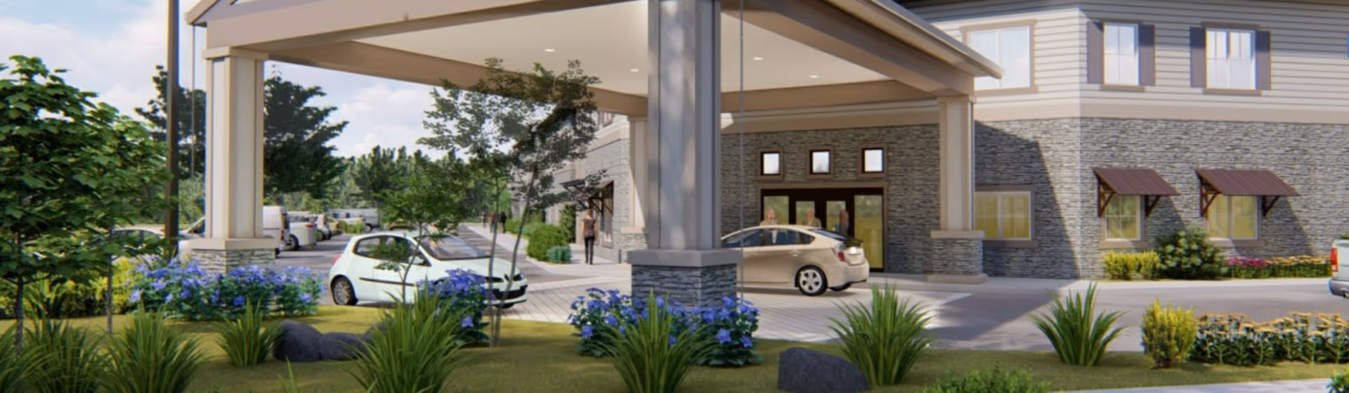 Front entrance of a senior living building with a covered porte-cochere, parked cars, and landscaped grounds.