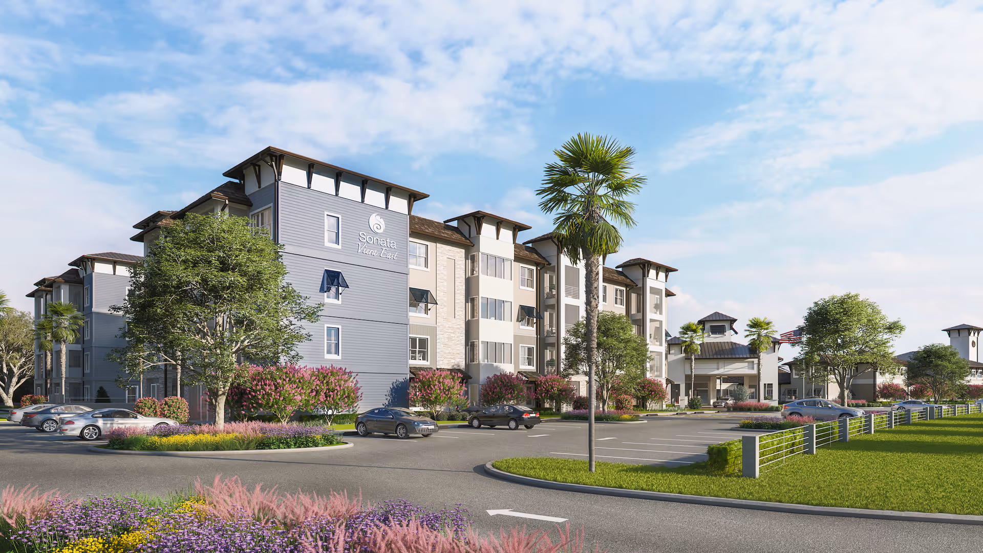 Exterior view of Sonata East at Viera, a multi-story senior living facility with landscaped grounds, palm trees, parked cars, and a clear blue sky.