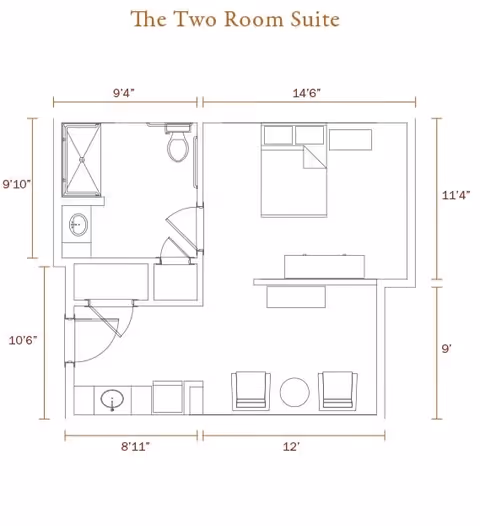Floor plan of a two-room suite showing a bedroom with a bed and desk, a living area with two chairs and a round table, a bathroom with a shower, toilet, and sink, and an entry area with a sink and storage.