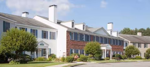 Exterior view of Langdon Place of Keene with manicured lawn and shrubs.