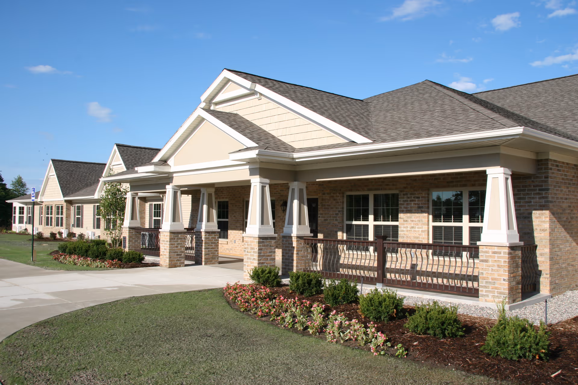 Exterior view of Chestnut Fields Retirement building with brick facade and a covered entrance.