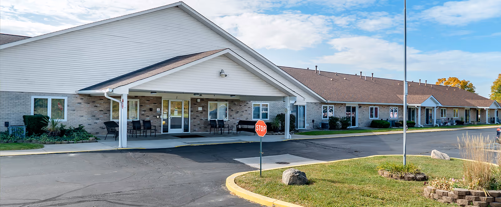 Exterior view of the Brookdale Adrian senior living facility showcasing the entrance and surrounding area.