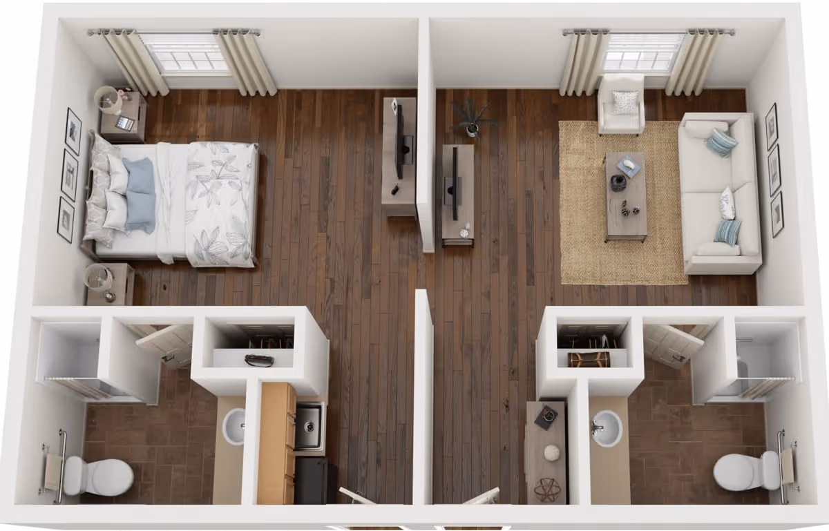 3D floor plan of a senior living apartment at The Avenues of Fort Bend showing a bedroom with a bed, nightstands, and windows on the left side, a living room with a sofa, armchair, coffee table, TV, and windows on the right side, two bathrooms with toilets and sinks, and a small kitchen area with a sink and cabinets in the center.