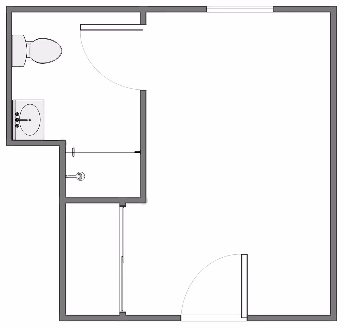 Floor plan layout showing a room with an attached bathroom that includes a toilet, sink, and shower area.