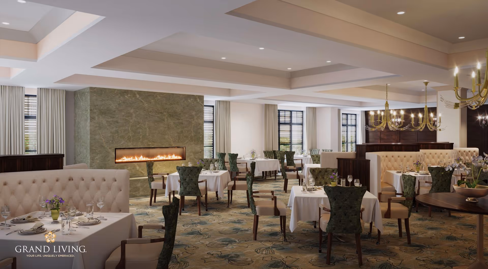 Elegant dining room with multiple tables covered in white tablecloths, set with plates, glasses, and silverware. The room features green upholstered chairs, beige tufted booth seating, large windows with curtains, a modern fireplace with a green marble surround, and gold chandeliers hanging from the ceiling.