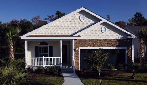 A single-story Lakeside Crossing facility with brick and white siding, front porch, and landscaped yard.