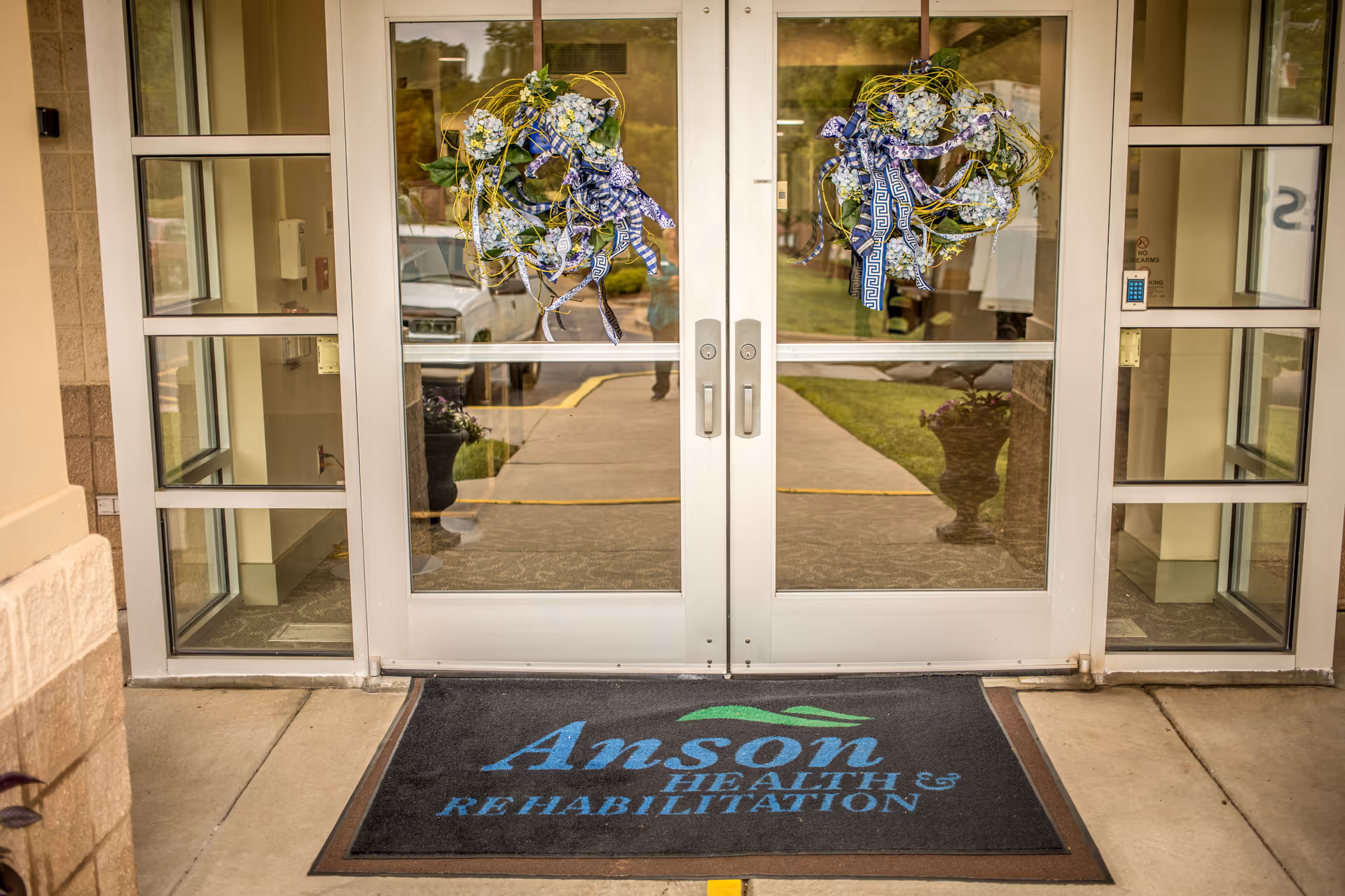 Entrance to Anson Health & Rehabilitation featuring decorative wreaths.