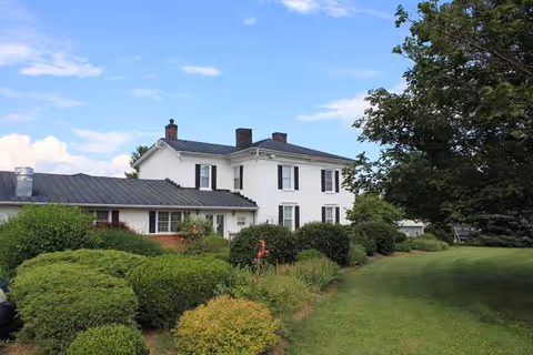 Living Waters Timberville exterior: white two-story building with landscaped shrubs and green lawn.