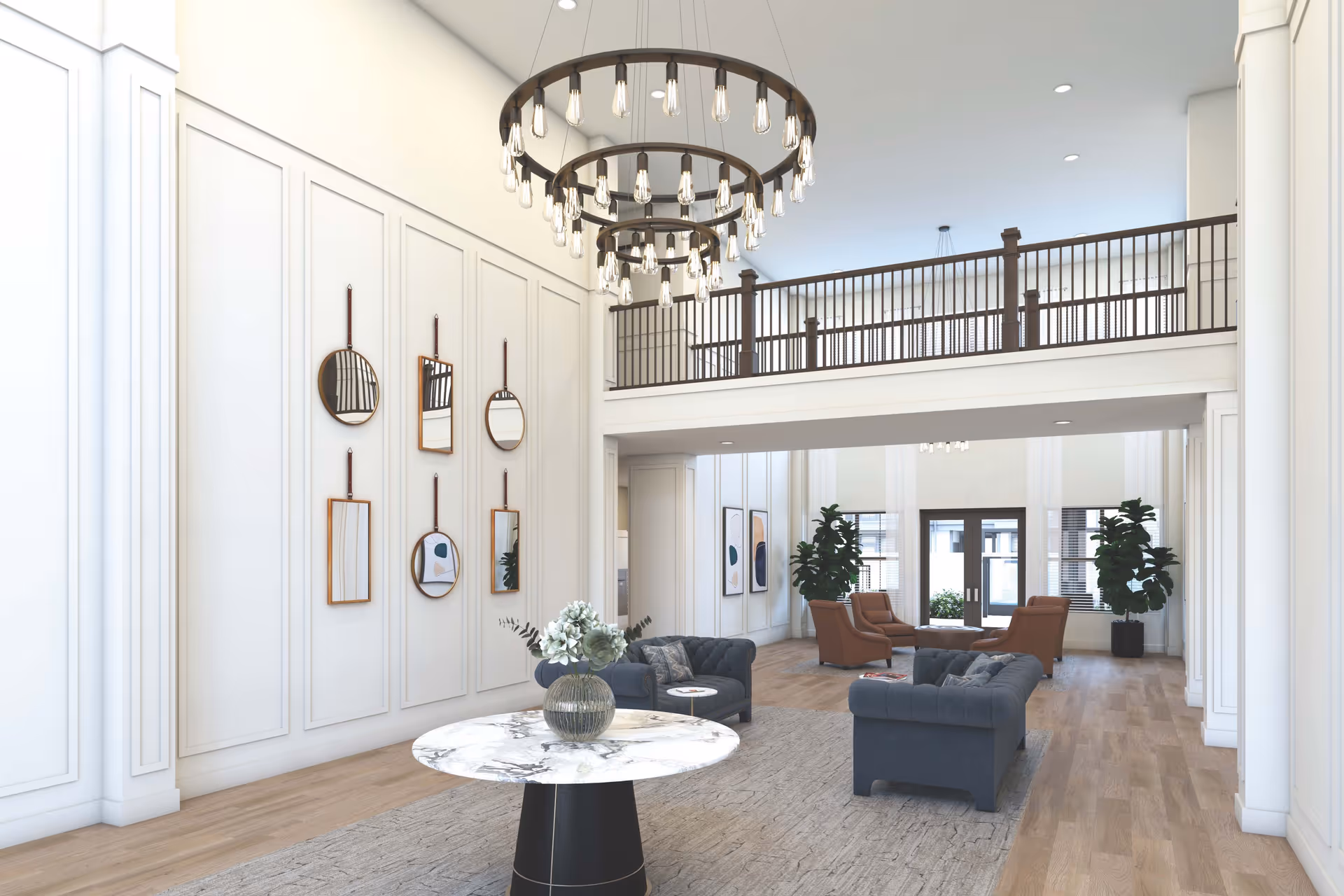 Spacious two-story lobby area with a large chandelier, seating arrangements, a central marble table, and decorative wall mirrors.