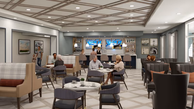 A modern senior living facility common area with multiple seating arrangements including tables with chairs and cushioned booths. Several seniors are seated and engaged in conversation. In the background, there is a bar area with a bartender and two large TV screens mounted on the wall. The ceiling has a decorative wooden lattice design, and the room is well-lit with pendant lights and recessed lighting.