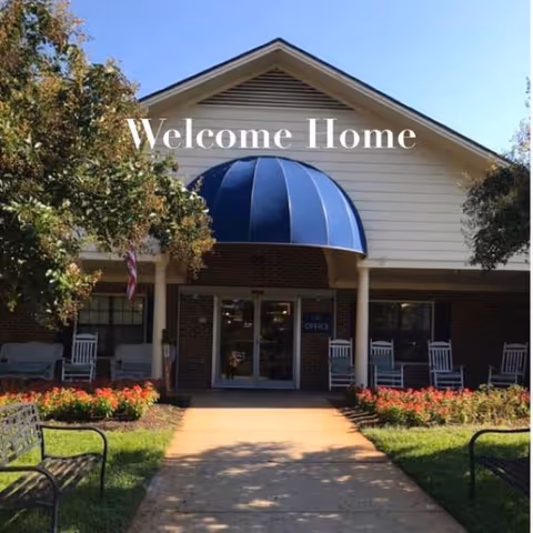 North Pointe senior living facility front entrance with blue dome canopy and landscaped walkway