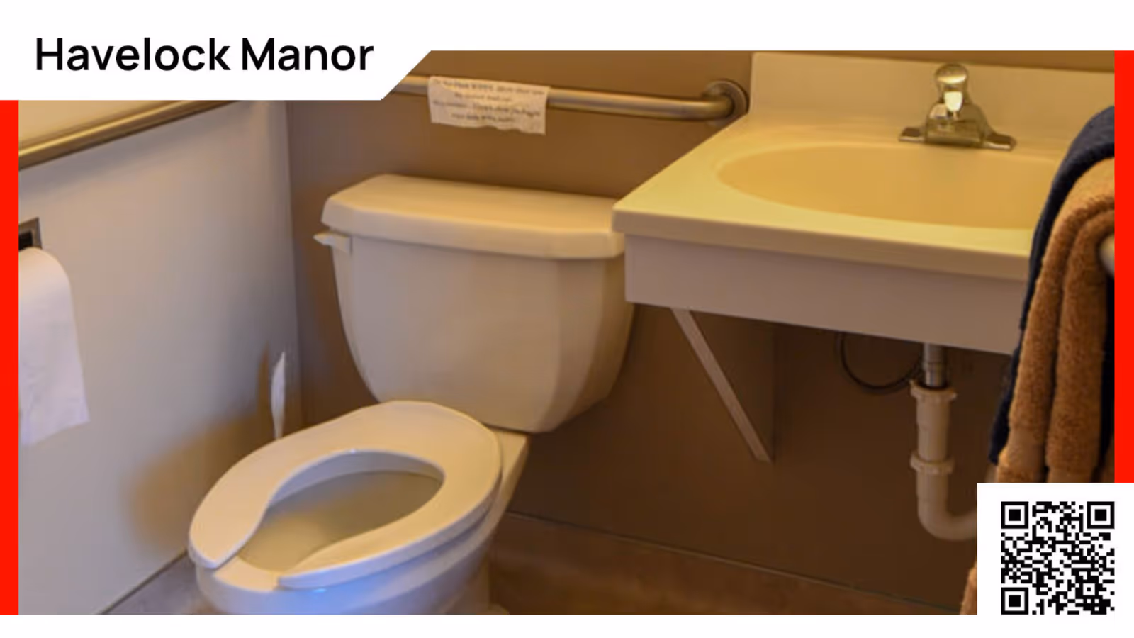 A small bathroom with a white toilet featuring an open front seat, a wall-mounted sink with a single faucet, a grab bar on the wall behind the toilet, and a towel hanging on the right side.