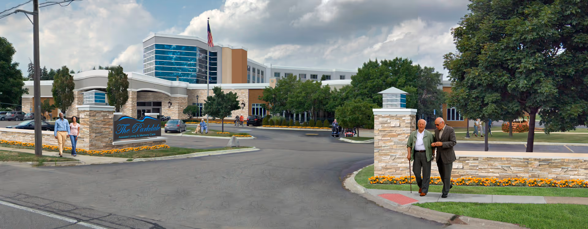 Exterior view of The Parkdale Senior Living facility showing a large building with multiple floors, an American flag, landscaped grounds with trees and flowers, and several people walking near the entrance and along the sidewalk.