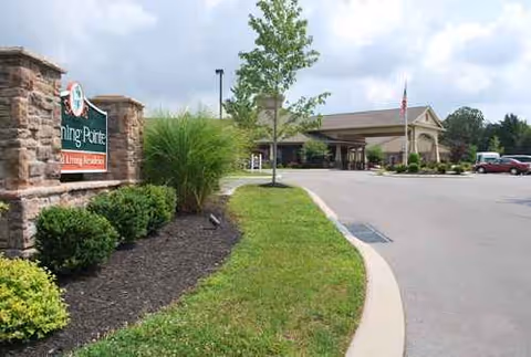Exterior view of Morning Pointe of Lenoir City with sign, landscaping, and entrance.