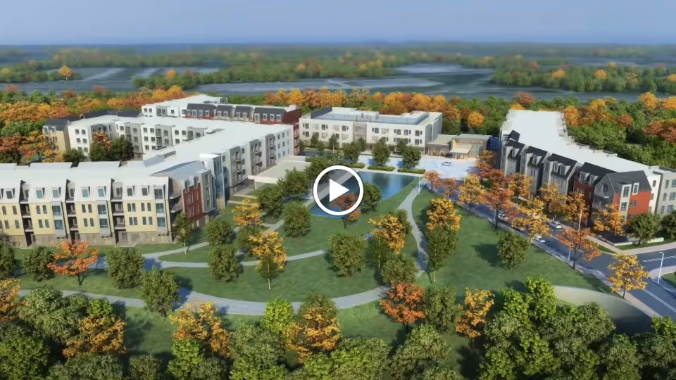 Aerial view of The Baldwin Senior Living campus showing multi-story residential buildings surrounding landscaped lawns and walking paths.