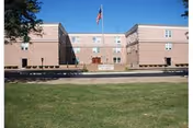 Kith Haven Nursing & Rehabilitation facility with flag outside and a green front lawn.