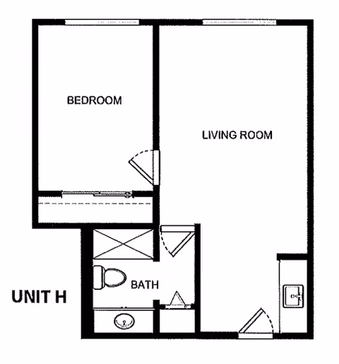 Floor plan of Unit H at Kamlu Retirement Inn-Vancouver showing a bedroom, living room, bathroom, and a small kitchen area.
