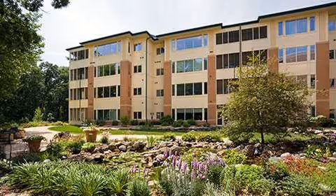 Oakwood Village Prairie Ridge building with manicured garden in foreground