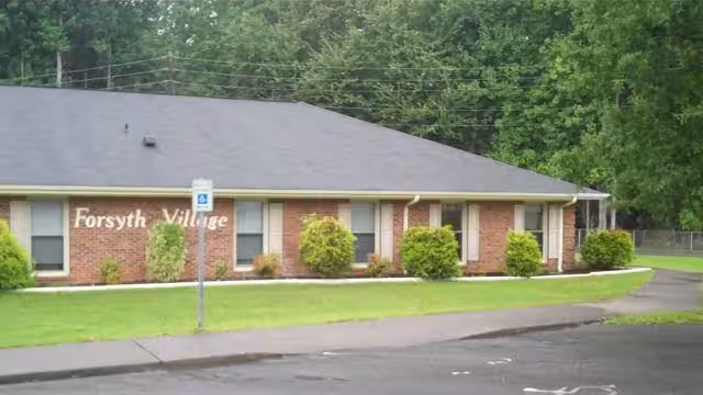 Exterior view of a senior living facility named Forsyth Village.