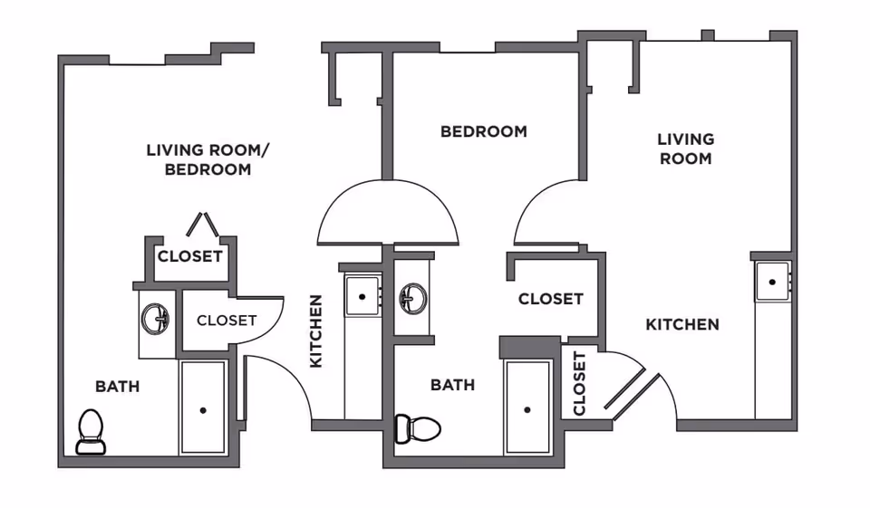 Black and white architectural floor plan showing two separate living units. The left unit includes a combined living room/bedroom, a kitchen, a bathroom with a toilet and sink, and two closets. The right unit includes a bedroom, a living room, a kitchen, a bathroom with a toilet and sink, and two closets.