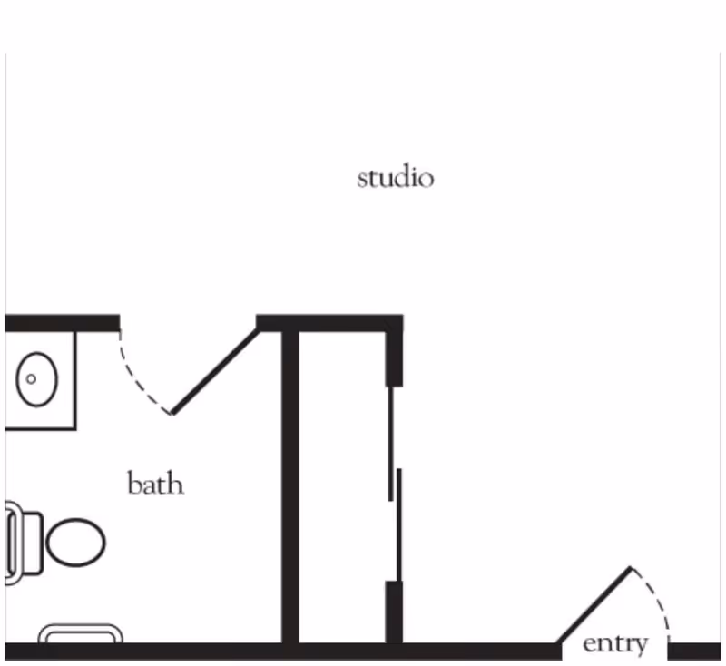 Floor plan layout of a studio apartment showing an entry area, a main studio space, and a bathroom with a toilet and sink.