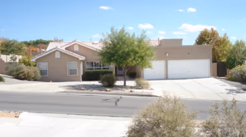 Single-story Haven Care building with driveway, garage, and desert landscaping.
