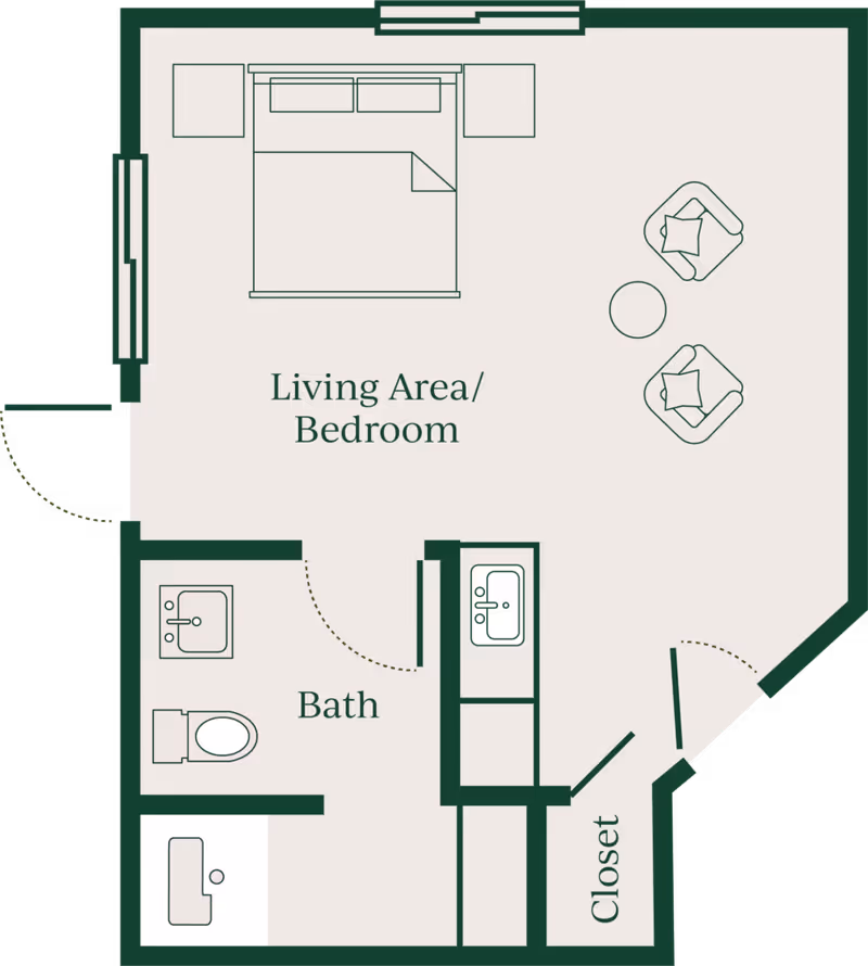 A simple floor plan of a studio unit showing a combined living area/bedroom with a bed and seating, an adjacent bath with sink and toilet, and a closet.