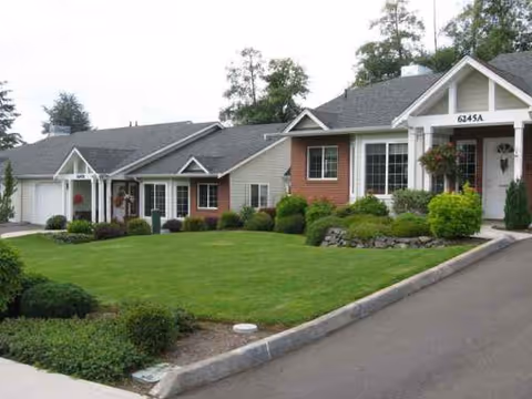 Franke Tobey Jones senior living building with manicured lawn and driveway.