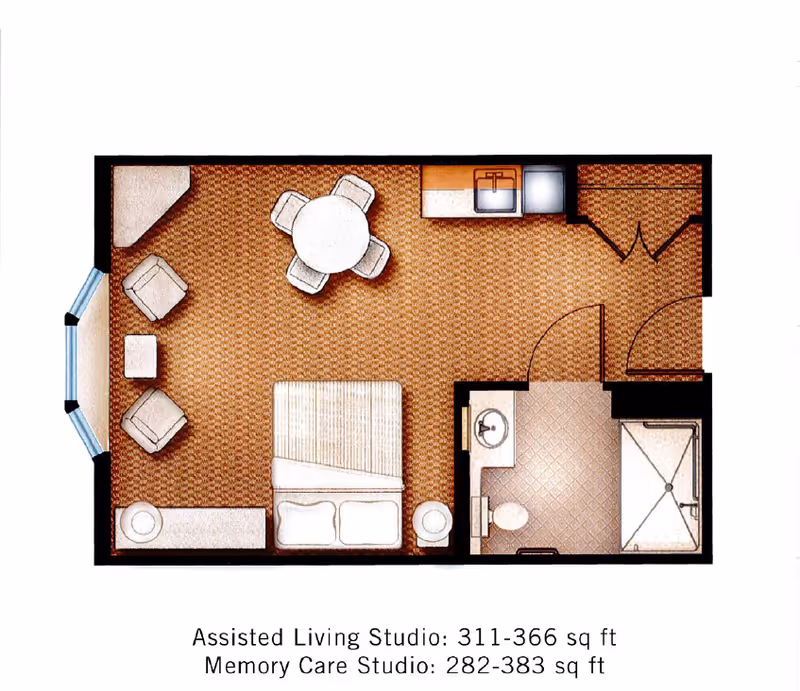 Top-down floor plan of a studio apartment showing a bed, seating area, round dining table, kitchenette and a bathroom.