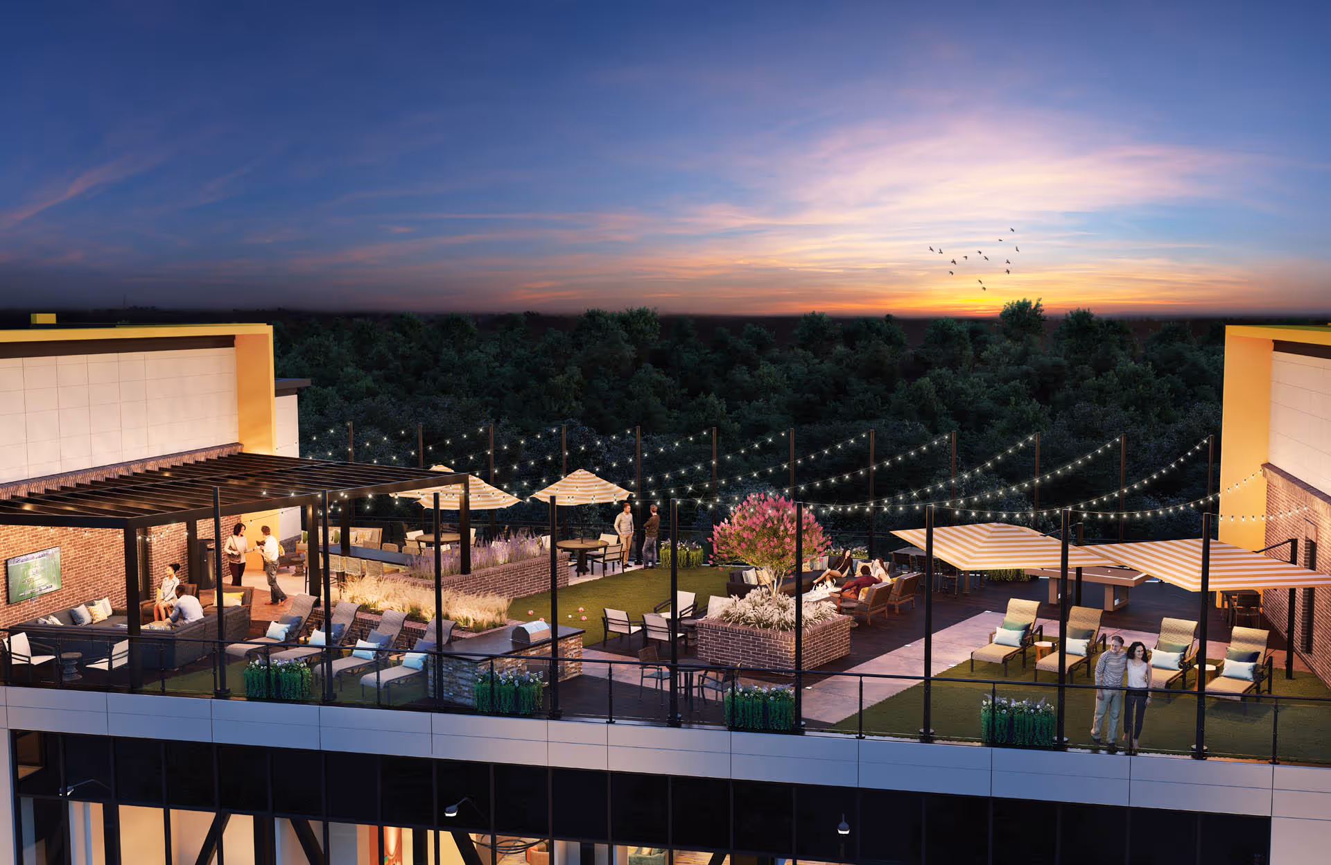 Rooftop outdoor terrace at sunset with lounge seating, umbrellas, string lights and a few people.