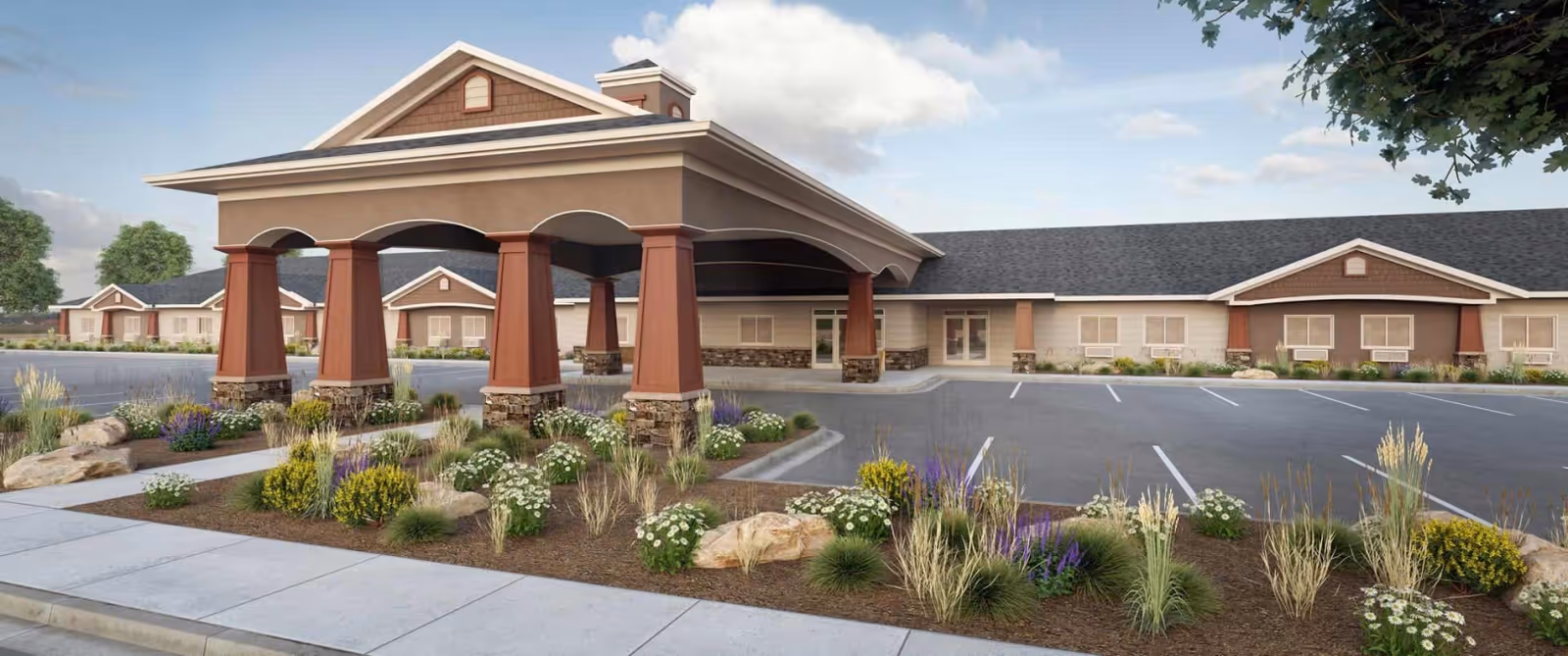 Exterior view of Aspen Creek Senior Living facility showing a covered entrance with large pillars, landscaped garden beds with various plants and flowers, a parking lot with marked spaces, and a long single-story building under a partly cloudy sky.