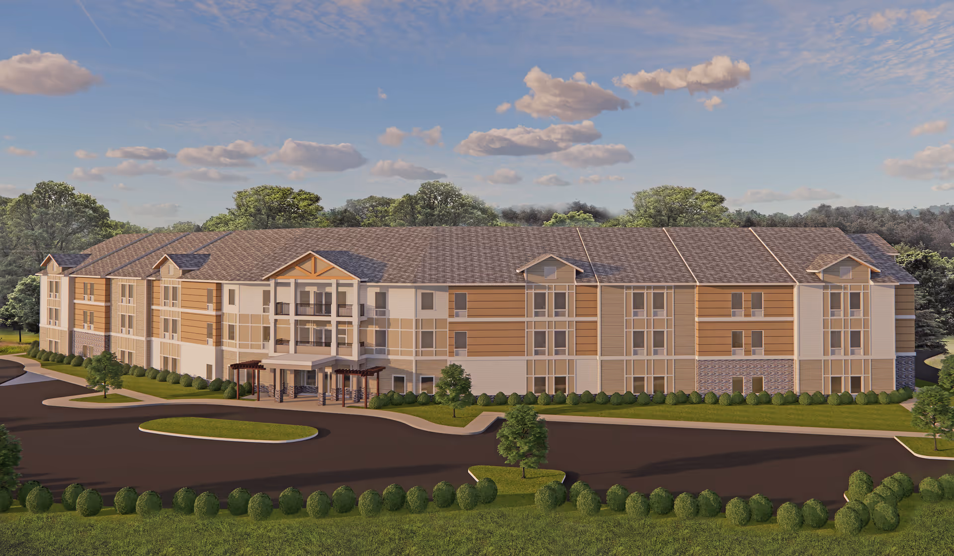 Exterior view of a large three-story senior living facility building with a pitched roof, multiple windows, and a covered entrance. The building is surrounded by landscaped greenery, trees, and a paved driveway under a partly cloudy sky.