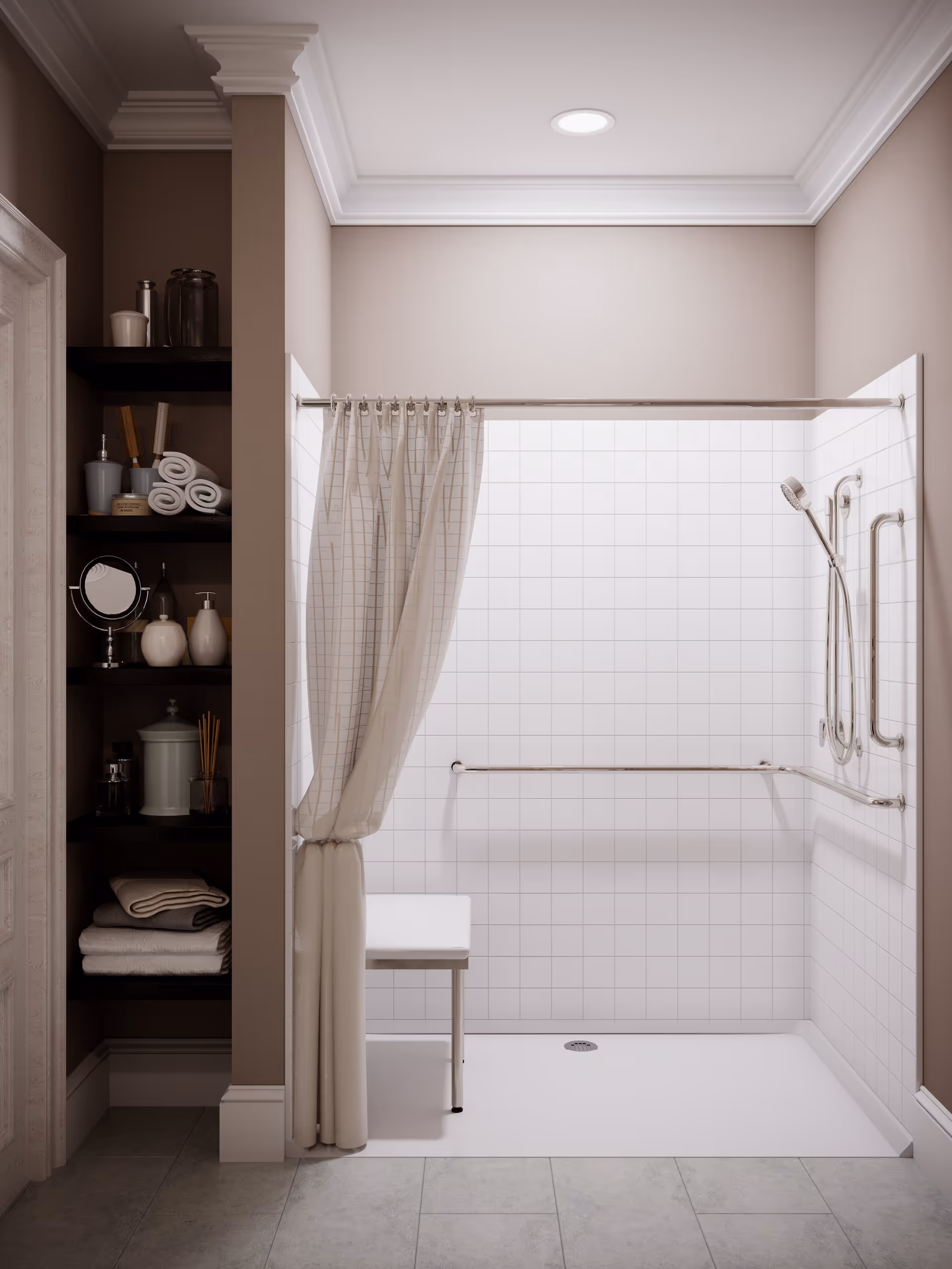 A clean and modern bathroom shower area with white tiled walls, a white shower curtain partially drawn to the side, a white shower bench, and multiple stainless steel grab bars for safety. To the left, there are built-in dark wooden shelves holding rolled towels, bottles, and other bathroom accessories. The floor is tiled in a light gray color, and the ceiling has crown molding with a recessed light.