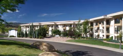 Exterior view of Brookdale Skyline senior living facility with landscaped grounds and driveway.