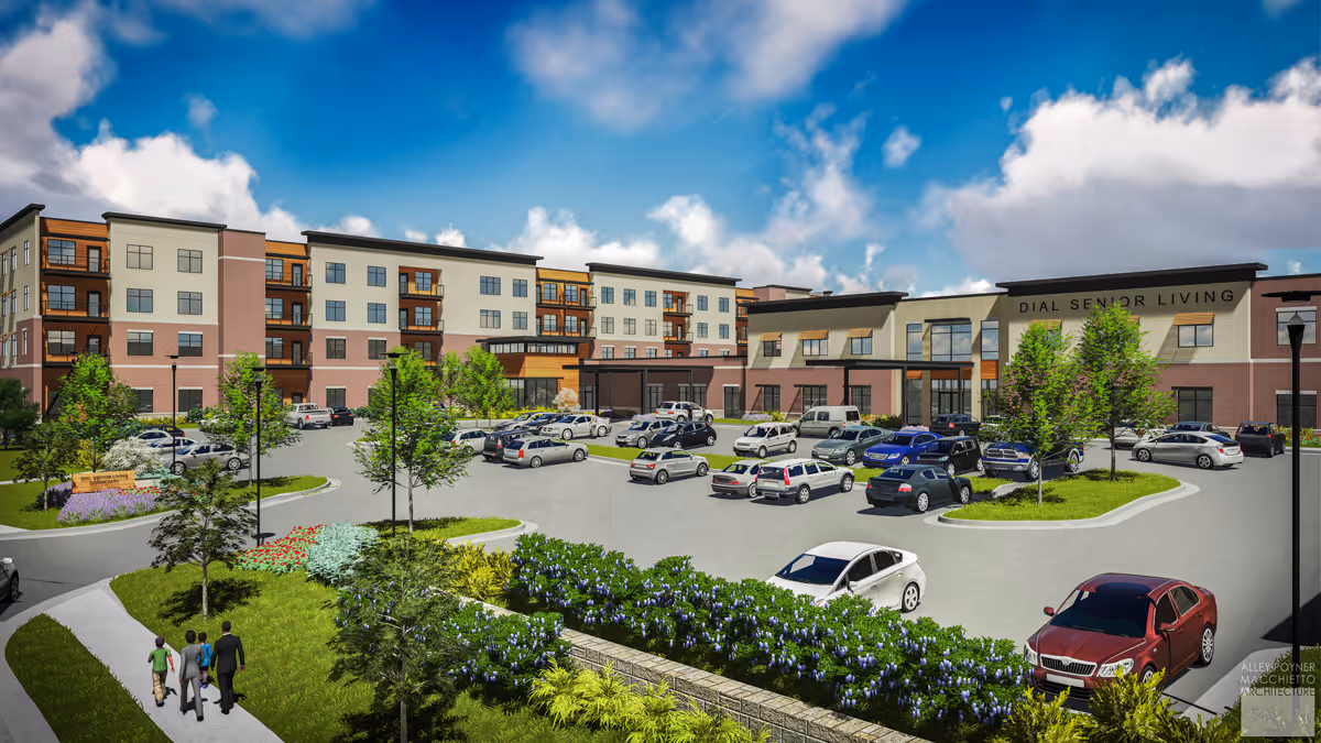 Exterior view of Silvercrest at College View Senior Living facility showing a large multi-story building with balconies, a parking lot filled with cars, landscaped greenery, and a few people walking on a sidewalk under a partly cloudy blue sky.